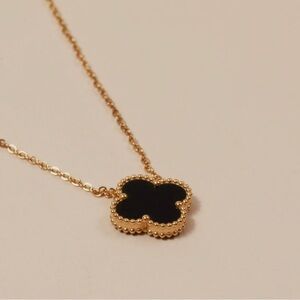 Elegant Gold and Black Clover Pendant Necklace